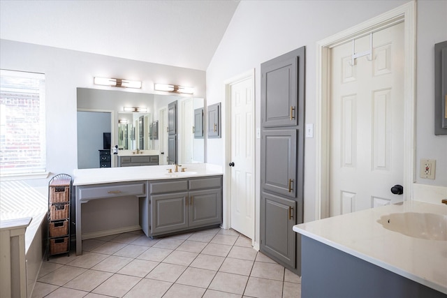 bathroom with vanity, tile patterned floors, ceiling fan, and lofted ceiling