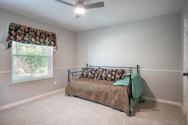 carpeted bedroom featuring ceiling fan