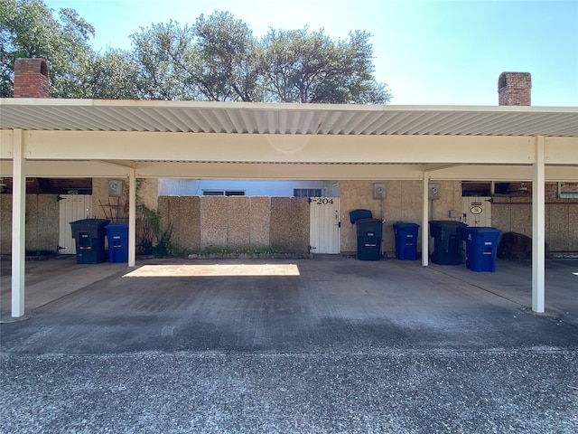 view of vehicle parking featuring a carport