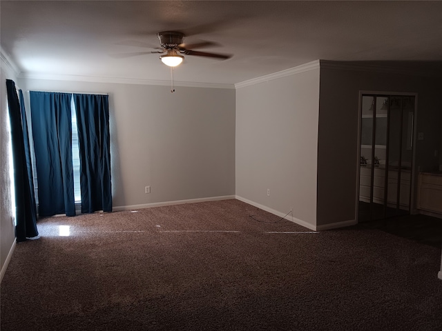 carpeted spare room with crown molding and ceiling fan