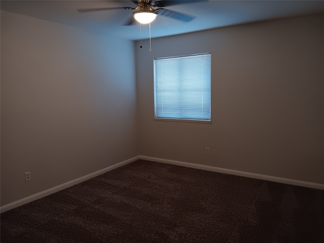 empty room featuring carpet flooring and ceiling fan