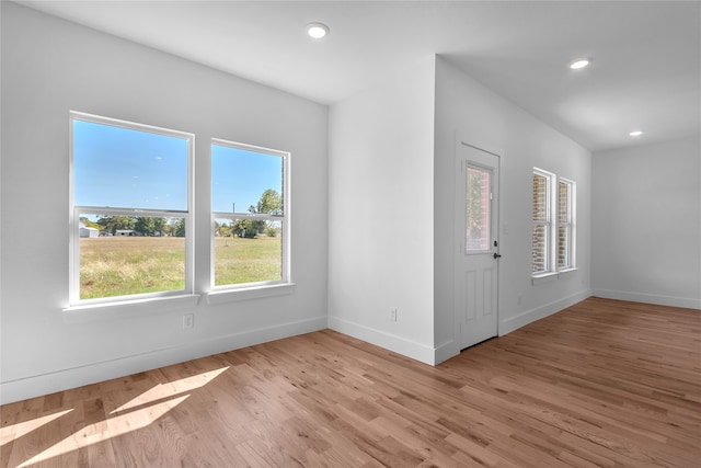 spare room featuring light wood-type flooring