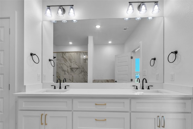 bathroom featuring vanity and a shower with shower door