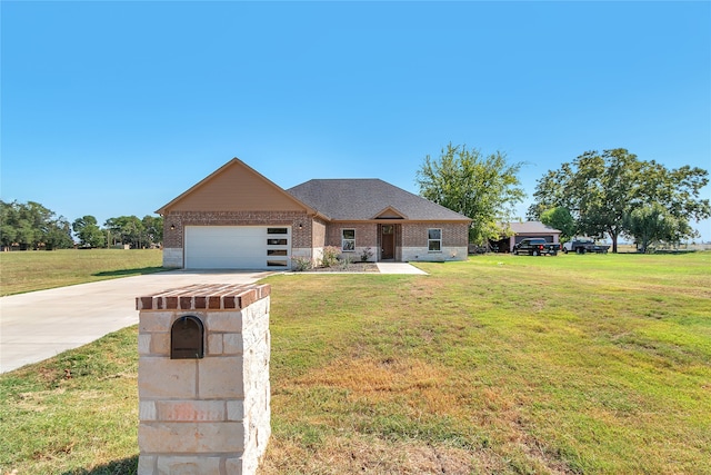 view of front of house featuring a front yard and a garage