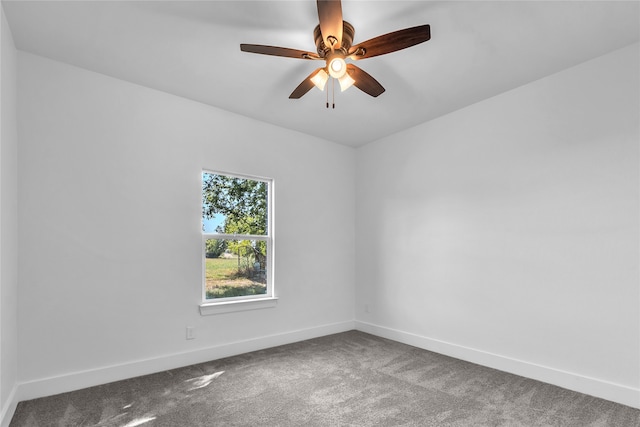 spare room featuring ceiling fan and carpet floors