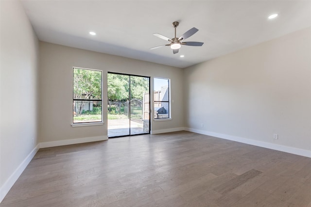 spare room featuring ceiling fan and hardwood / wood-style floors