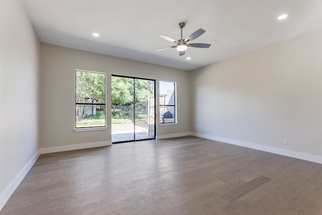 unfurnished room featuring hardwood / wood-style flooring and ceiling fan