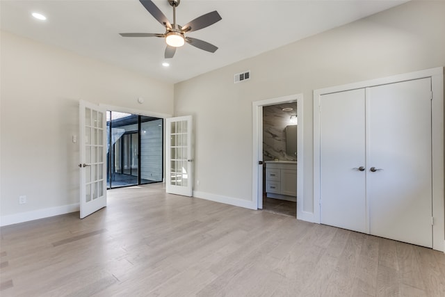 unfurnished bedroom with french doors, access to exterior, a closet, ceiling fan, and light hardwood / wood-style flooring