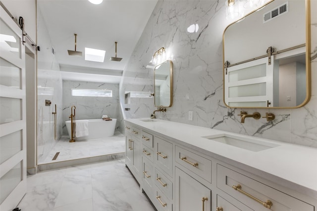 bathroom featuring vanity, a skylight, independent shower and bath, and tile walls