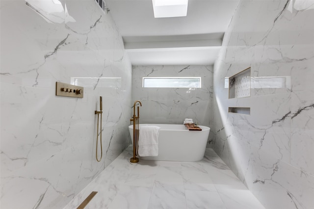 bathroom with a tub to relax in