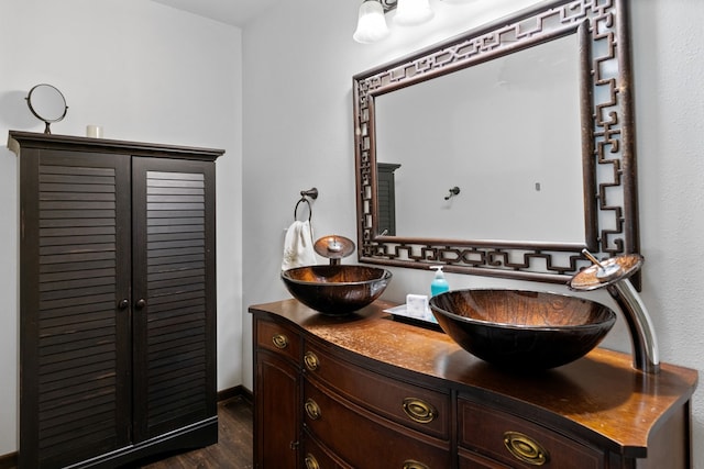 bathroom featuring vanity and hardwood / wood-style floors