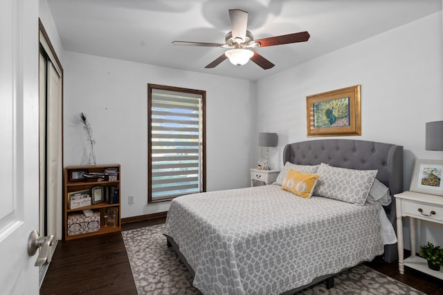 bedroom featuring ceiling fan and dark hardwood / wood-style flooring