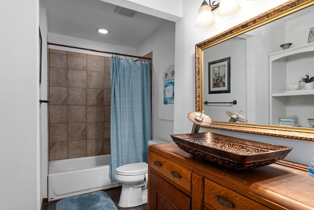 full bathroom featuring vanity, toilet, and shower / bathtub combination with curtain