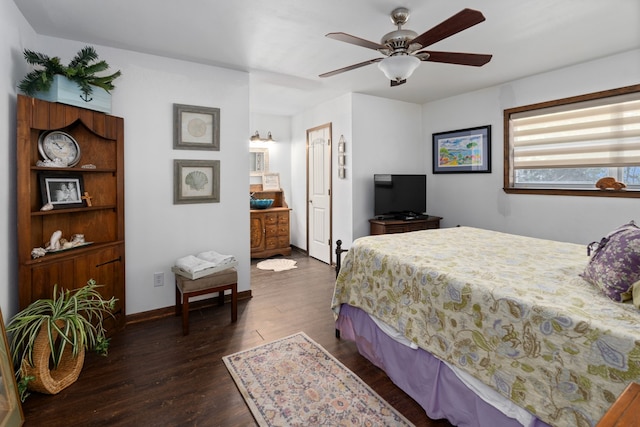 bedroom with ceiling fan and dark hardwood / wood-style flooring