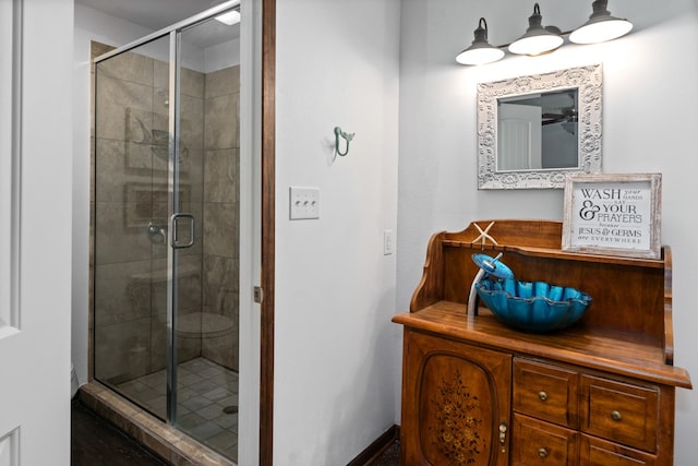 bathroom with an enclosed shower and vanity