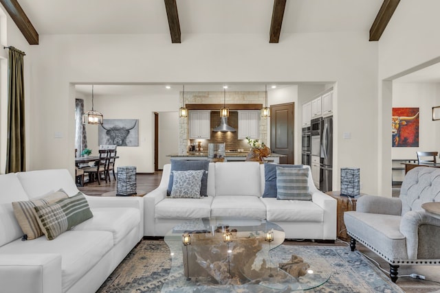 living room featuring wood-type flooring and beamed ceiling