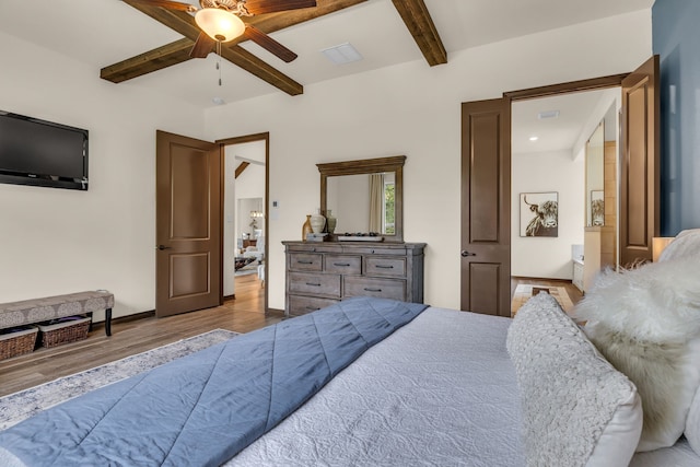 bedroom featuring ceiling fan, beamed ceiling, and light hardwood / wood-style floors