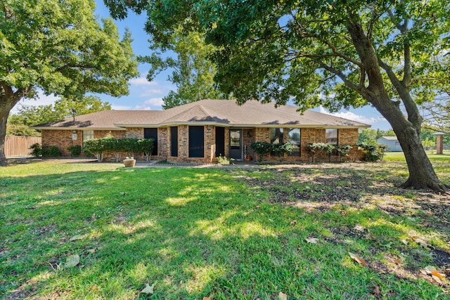 ranch-style home with a front yard