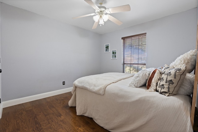 bedroom with ceiling fan and dark hardwood / wood-style floors