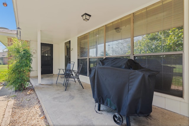 view of patio featuring a grill