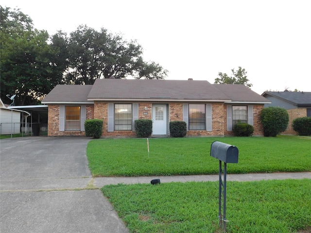 single story home with a carport and a front lawn