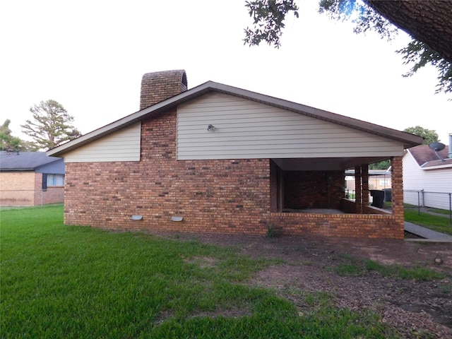 view of property exterior with a yard