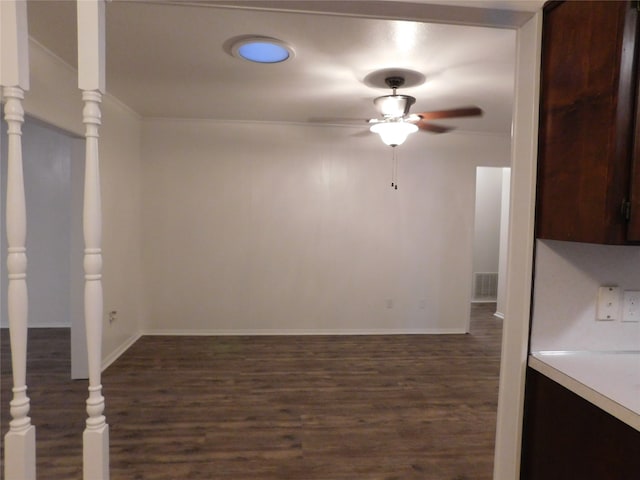 interior space with dark hardwood / wood-style floors and ceiling fan