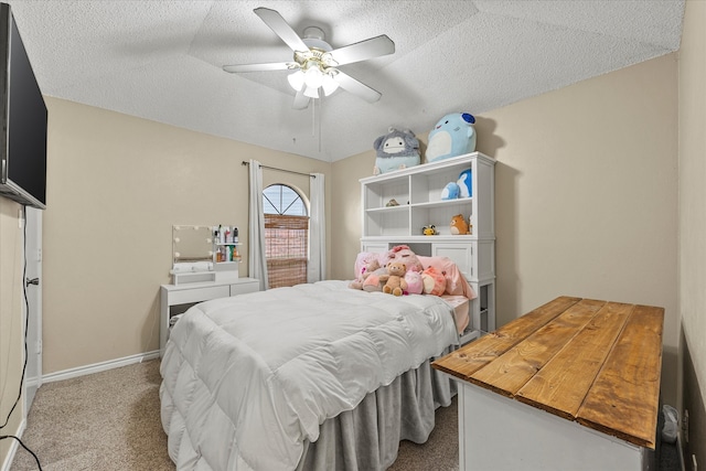 carpeted bedroom featuring vaulted ceiling, a textured ceiling, and ceiling fan