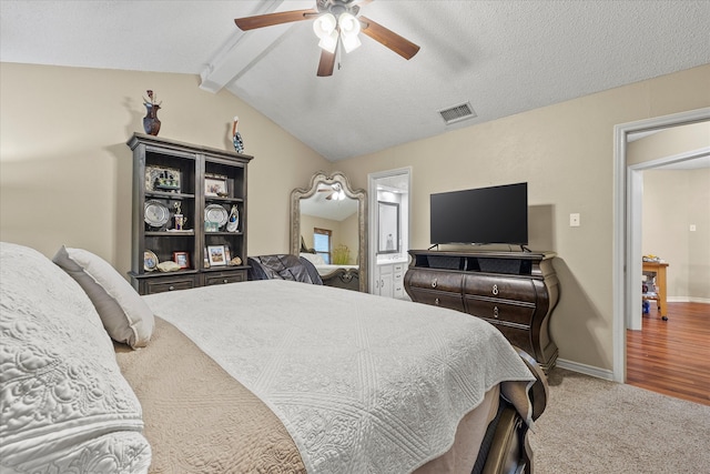 bedroom featuring vaulted ceiling with beams, hardwood / wood-style flooring, a textured ceiling, and ceiling fan