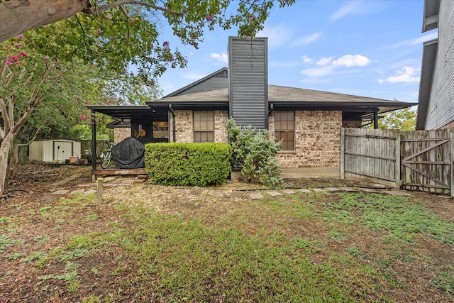 back of property with a shed