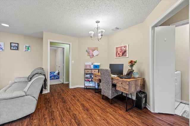 office space featuring a notable chandelier, hardwood / wood-style floors, and a textured ceiling