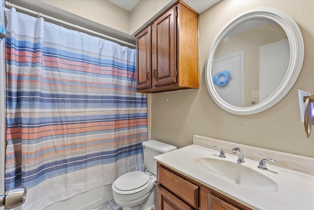 full bathroom with vanity, shower / tub combo with curtain, toilet, and a textured ceiling