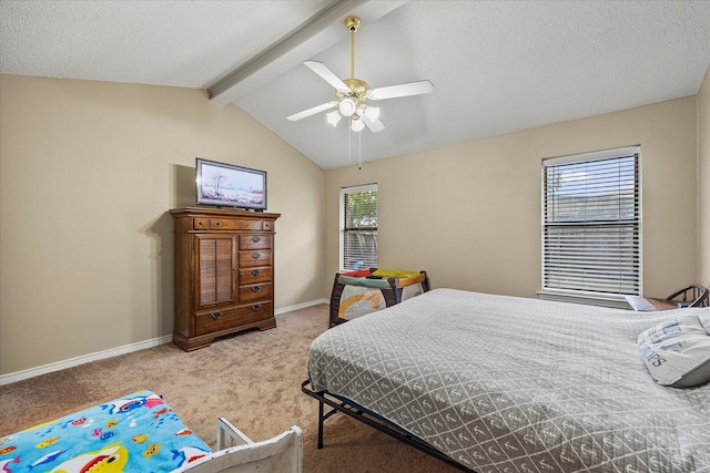 bedroom with ceiling fan, light colored carpet, a textured ceiling, and lofted ceiling with beams