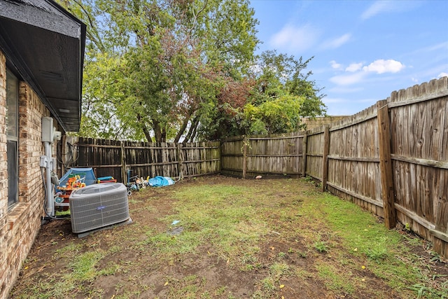 view of yard with central air condition unit