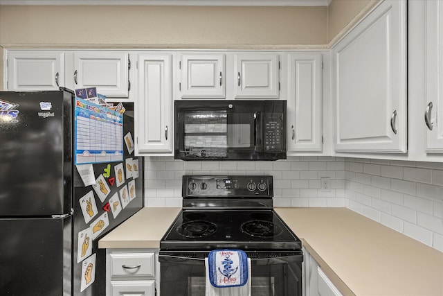 kitchen with black appliances and white cabinetry