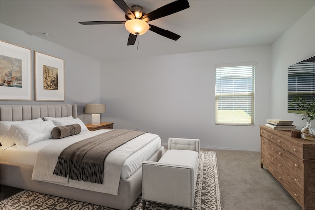 bedroom with light carpet and ceiling fan