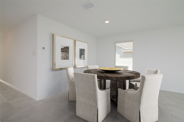 dining space with light tile patterned flooring