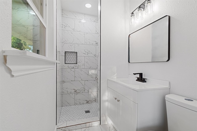 233 Oak Dr E, Hurst, TX 76053 - bathroom with marble look tiles, toilet, a walk in shower, vanity, and recessed lighting