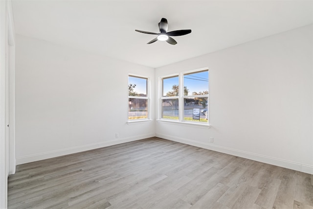 unfurnished room with ceiling fan and light hardwood / wood-style flooring