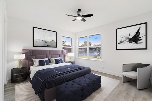 bedroom featuring ceiling fan and light hardwood / wood-style flooring