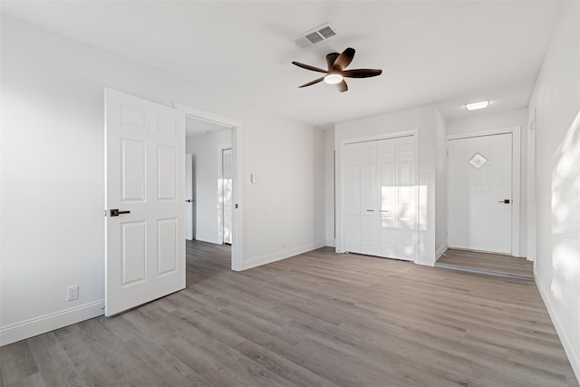 interior space featuring a closet, ceiling fan, and light hardwood / wood-style flooring