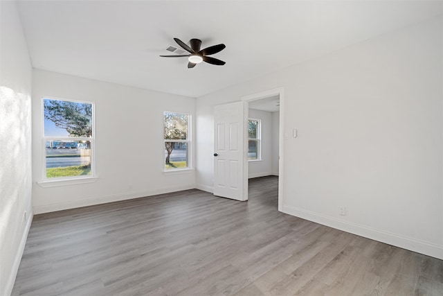 spare room featuring ceiling fan and light wood-type flooring