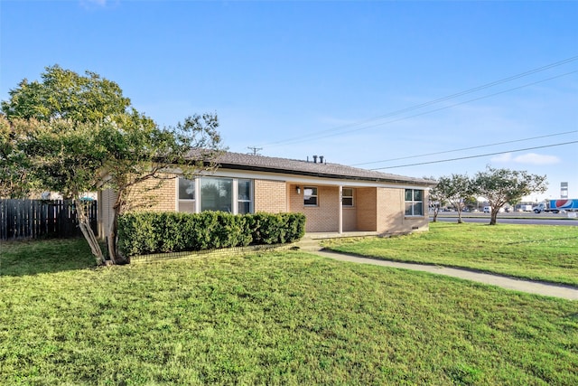 single story home with a front yard