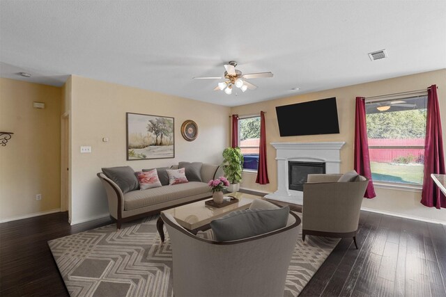 bedroom featuring multiple windows, light colored carpet, and ceiling fan