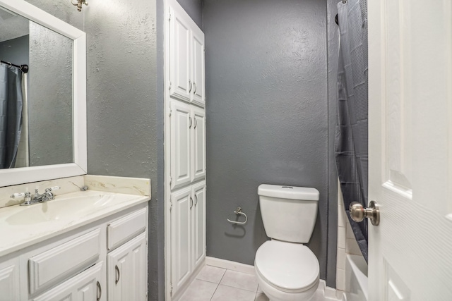 full bathroom with tile patterned flooring, shower / bath combo, vanity, and toilet