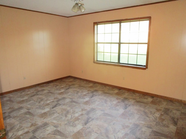 unfurnished room featuring crown molding