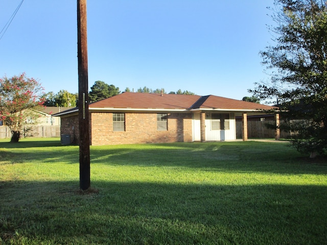 single story home with a front lawn and cooling unit