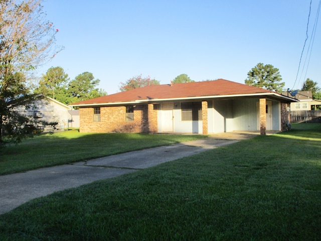 ranch-style home with a front lawn