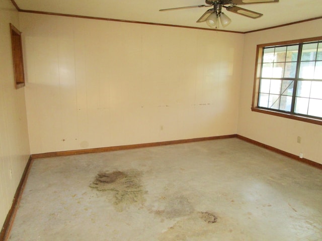 empty room with crown molding and ceiling fan