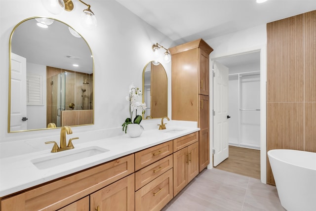 bathroom with tile patterned flooring, shower with separate bathtub, and vanity